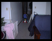 Logan riding his bike down the hall.