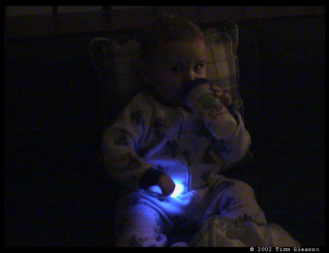 Logan ready for bed with a glostick.