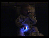 Logan ready for bed with a glostick.