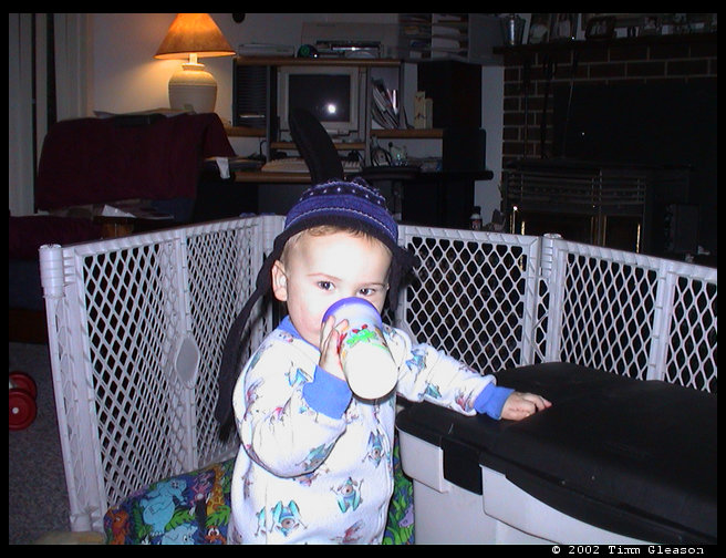 Logan ready for bed with his ski hat on.