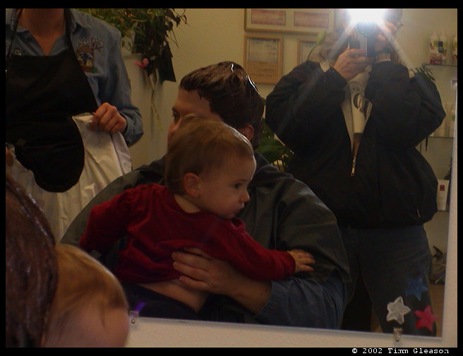 Mommy holding Logan getting ready for his first haircut.