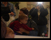 Mommy holding Logan getting ready for his first haircut.