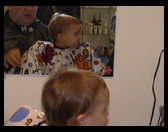 Logan with the haircut cape on.