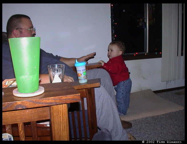 Logan checking out dad banging on the chair.