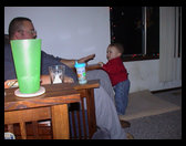 Logan checking out dad banging on the chair.