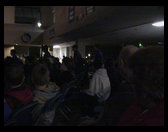 Very dark picture of Tyler walking by.