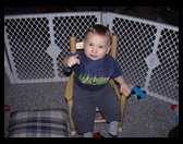 Pointing at the camera.