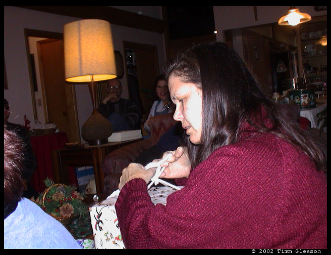 Grandma/Mom Zoe opening her exchange present.