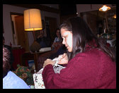 Grandma/Mom Zoe opening her exchange present.