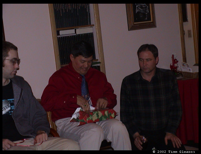 Zac, Greg and Dave taking in Greg's present.