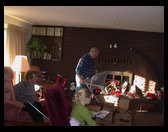 Mom, Dad and Lisa getting ready to open presents.