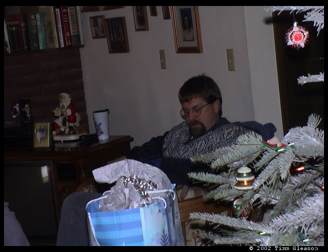 David opening a present. 