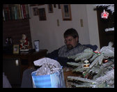 David opening a present. 