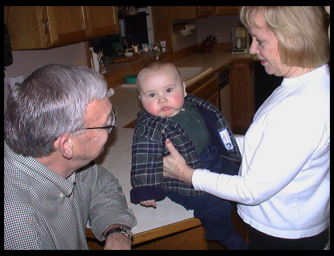 Uncle Mike and Aunt Bette McQuade with Logan.
