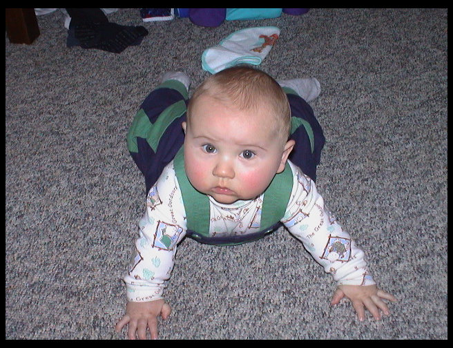 Logan crawling backwards.