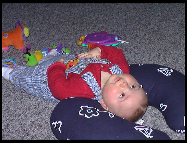 Logan hanging out on the boppy.