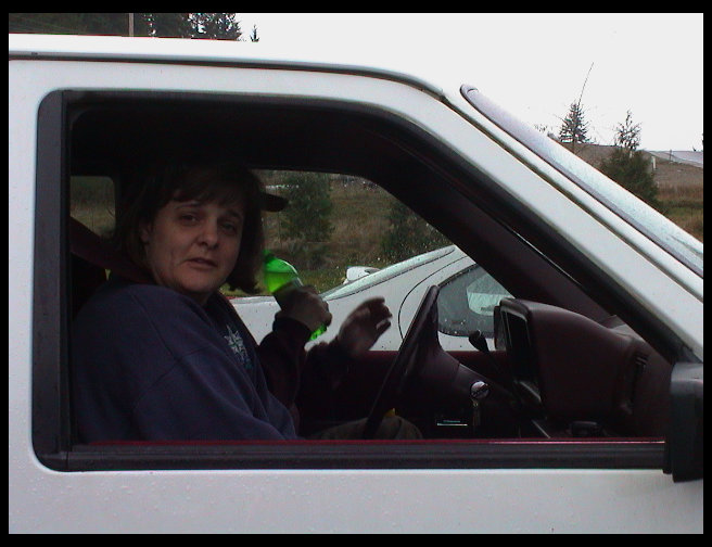 Kari waiting for Sandra to get her coffee and get in the car.