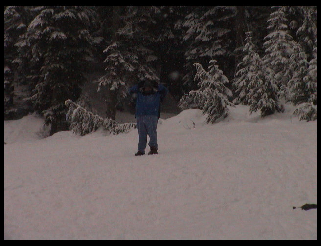 Sandra standing up on the side of the hill.