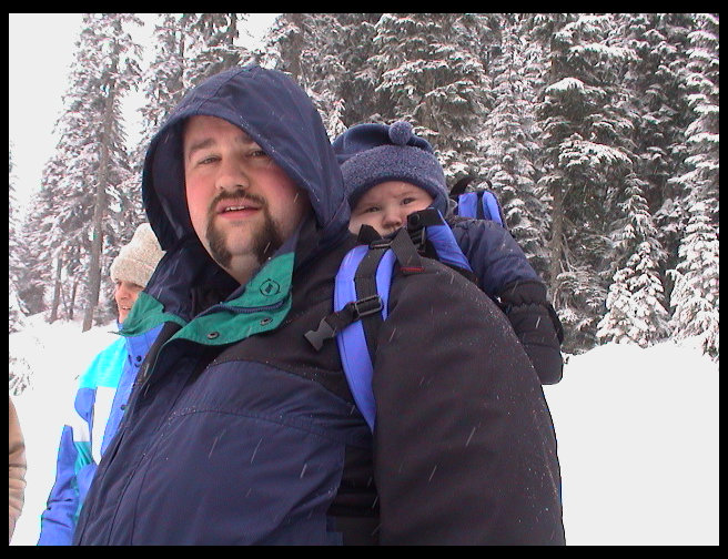 Boy, Logan looks comfy on Daddy's back.