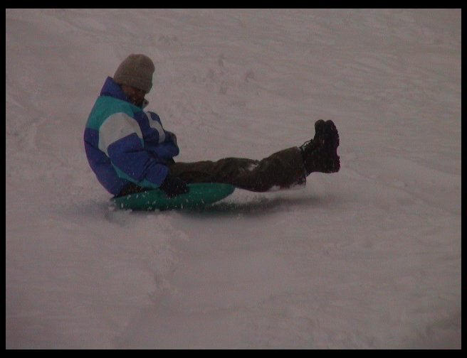 There goes Kari sledding down the hill.