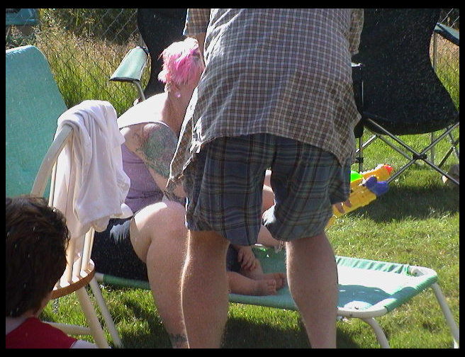 Eric trying to give Logan a squirt gun.