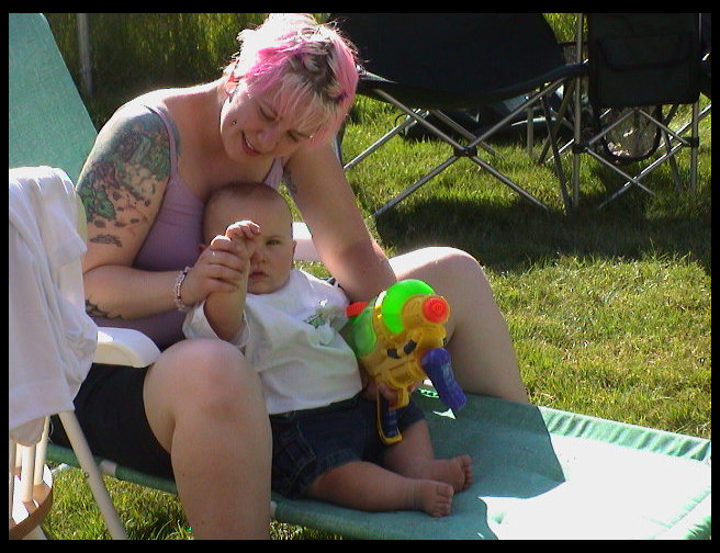 Amber helping Logan wave 