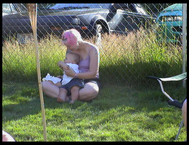 Logan eating Amber's corn.