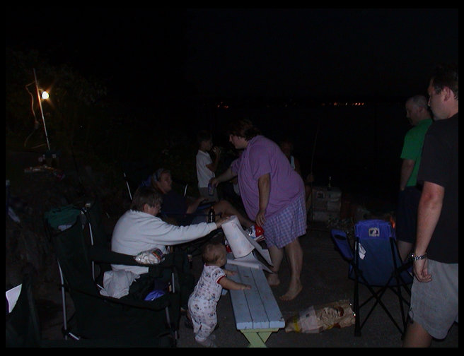 Everyone enjoying a little snack at the beach.