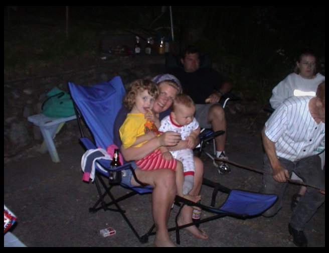 Debbie holding Maddie and Logan.