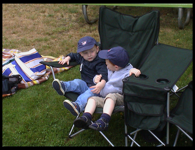 Jared and Walt sharing a chair.