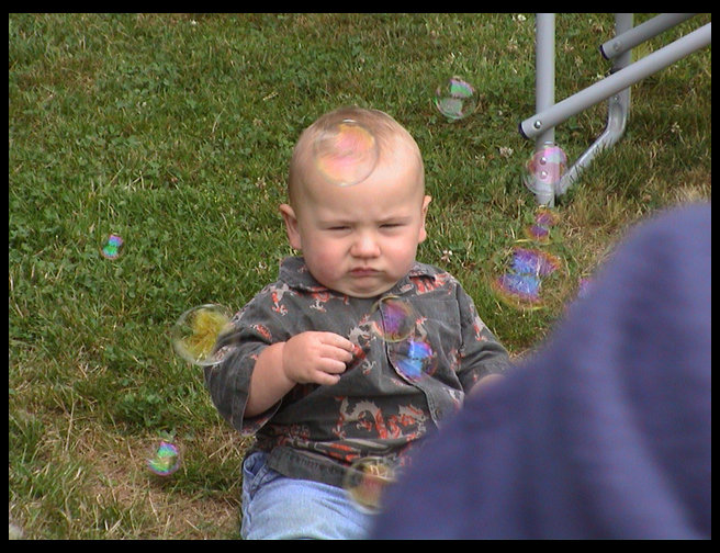 Logan enjoying bubbles.
