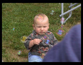 Logan enjoying bubbles.