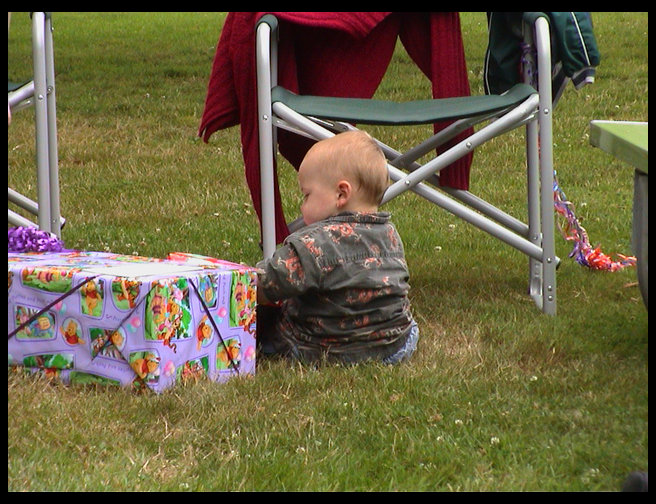 Logan looking at his presents.