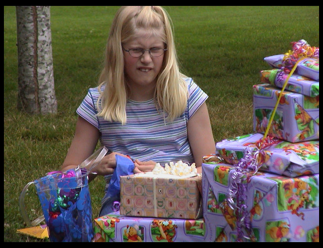 There is Lisa opening her presents too.