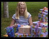 There is Lisa opening her presents too.