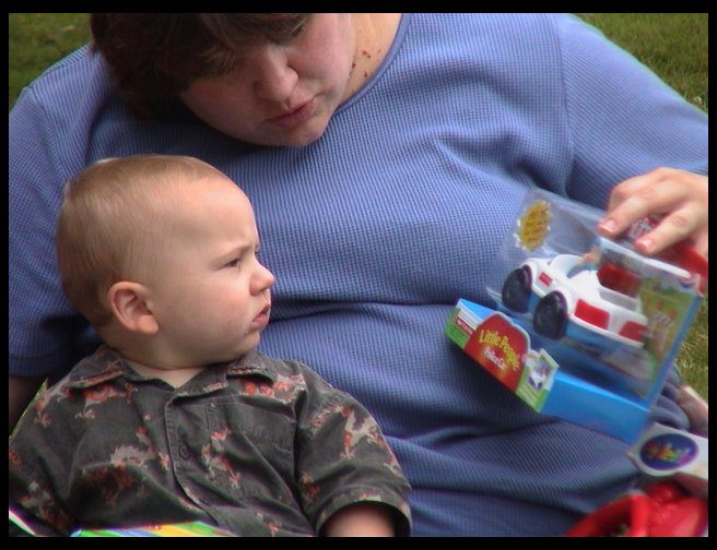 Logan looking at his new police car.