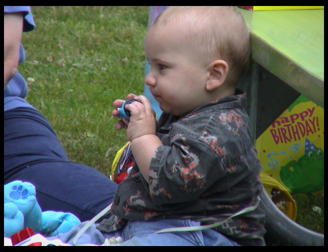 Logan kissing his little people.