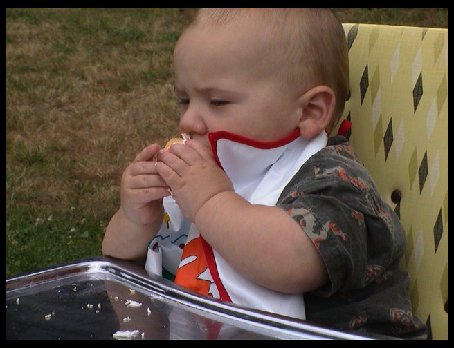I think Logan likes his cupcake.