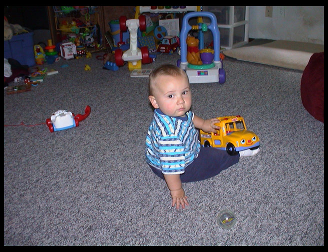 Playing with his new school bus.