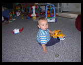 Playing with his new school bus.