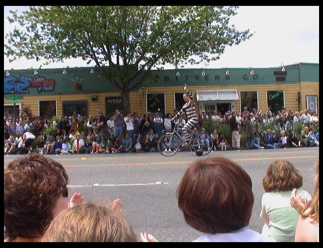This is a nude bicyclist with body paint on.