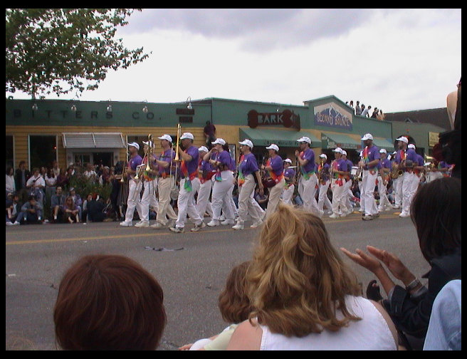 A band in purple shirts.