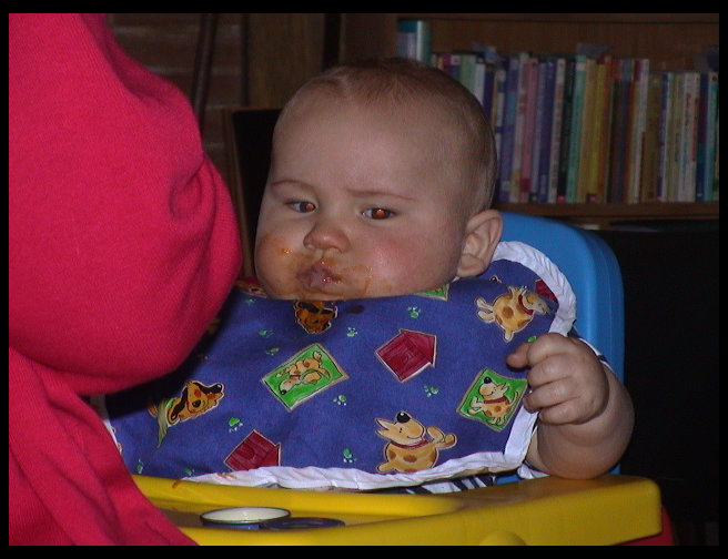 Being fed at Aunt Heather's.