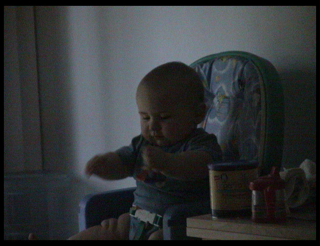 Logan in his highchair.