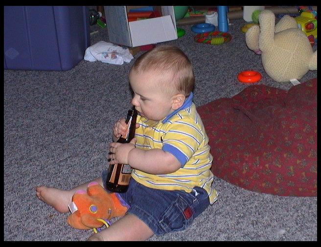 Yes, that is a beer bottle Logan has.