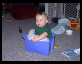 Logan is in this tub that holds his blocks usually.