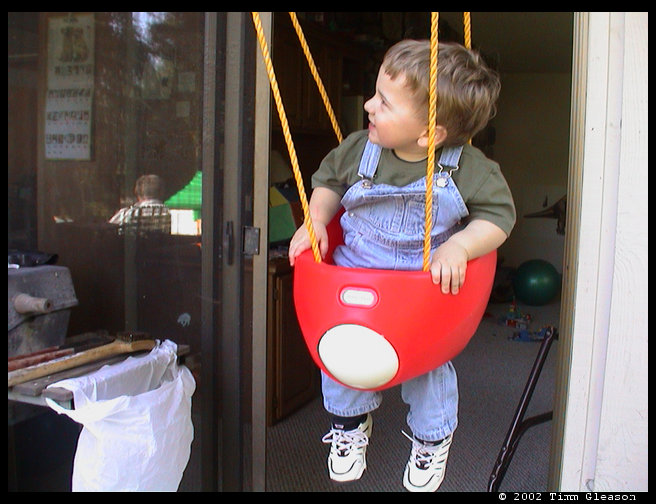 Logan swinging.