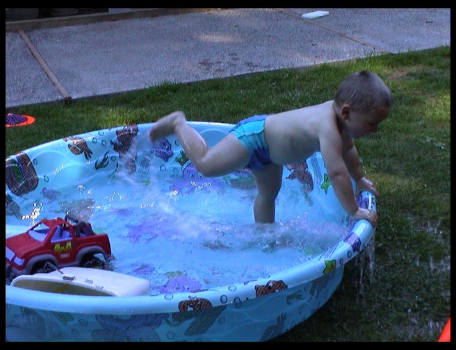 Logan thought it was great to kick and see the water fly.