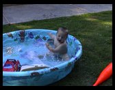 Our little boy in his wading pool.