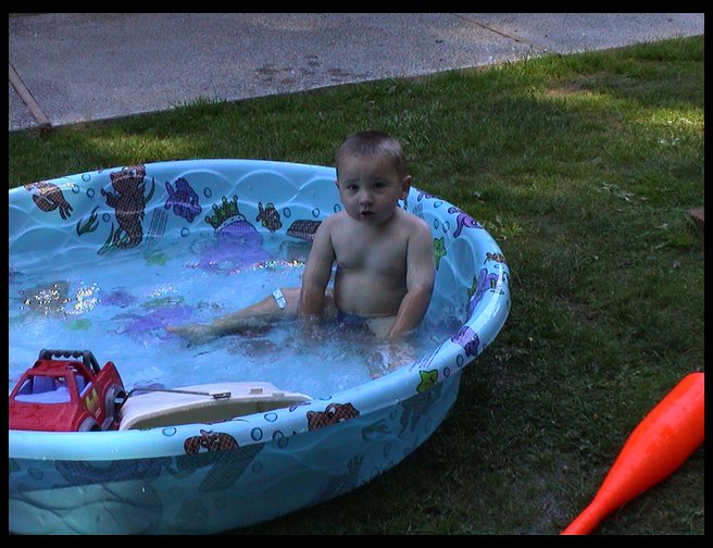 Naked boy in the pool.
